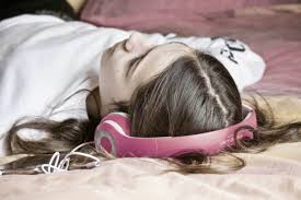 Person listening to music with headphones